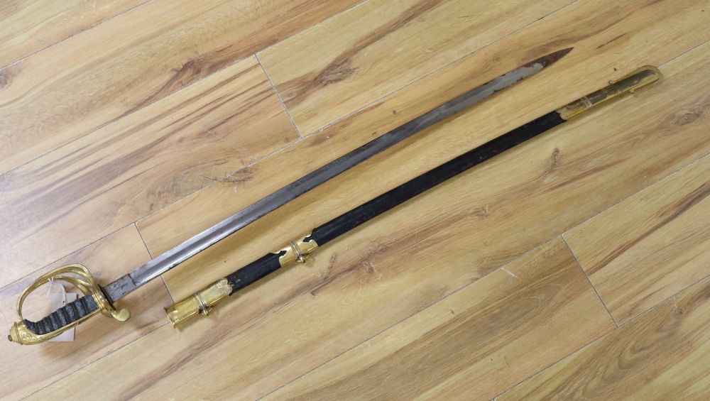 A Victorian officers sword, shagreen grip and 81cm curved, etched, single-edged blade, gilt metal scabbard, inscribed and personalised